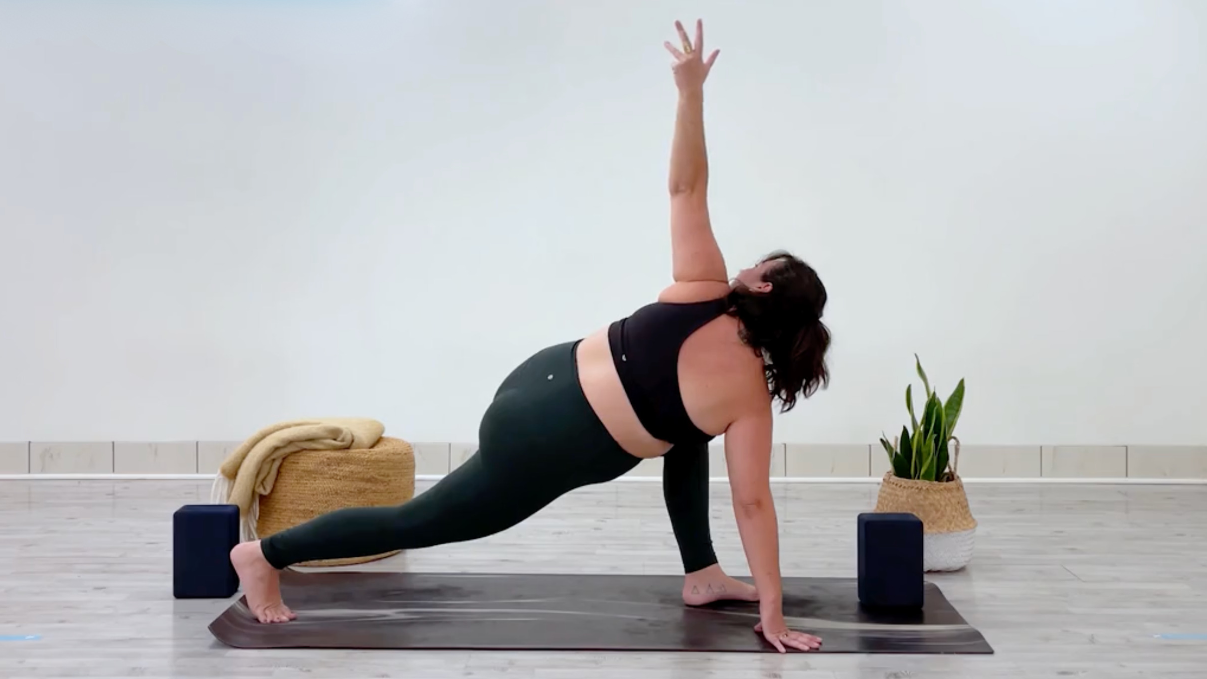 Teacher Taylor Lorenz in Revolved Runner's Lunge